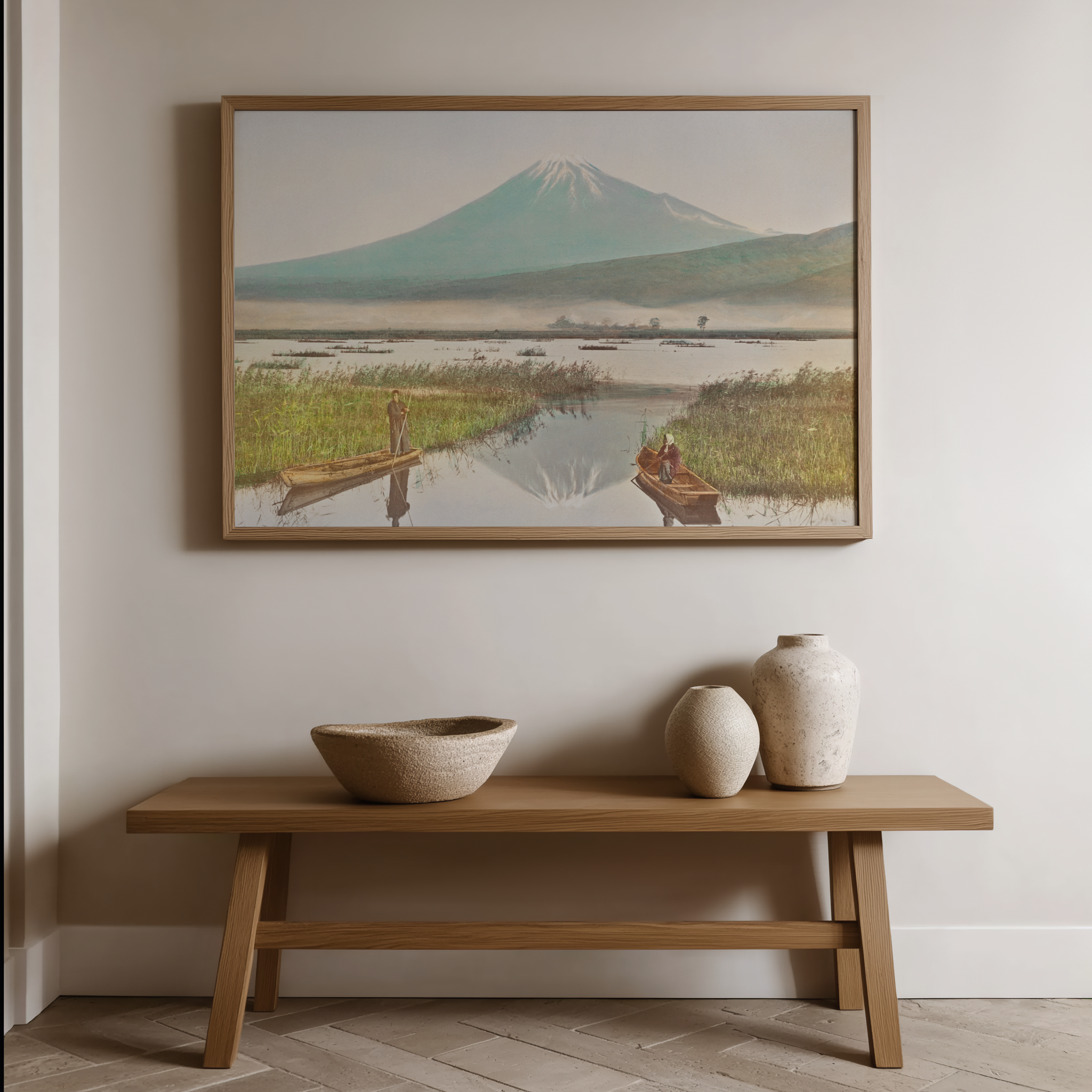 Framed artwork of a mountain landscape above a wooden bench with decorative items.