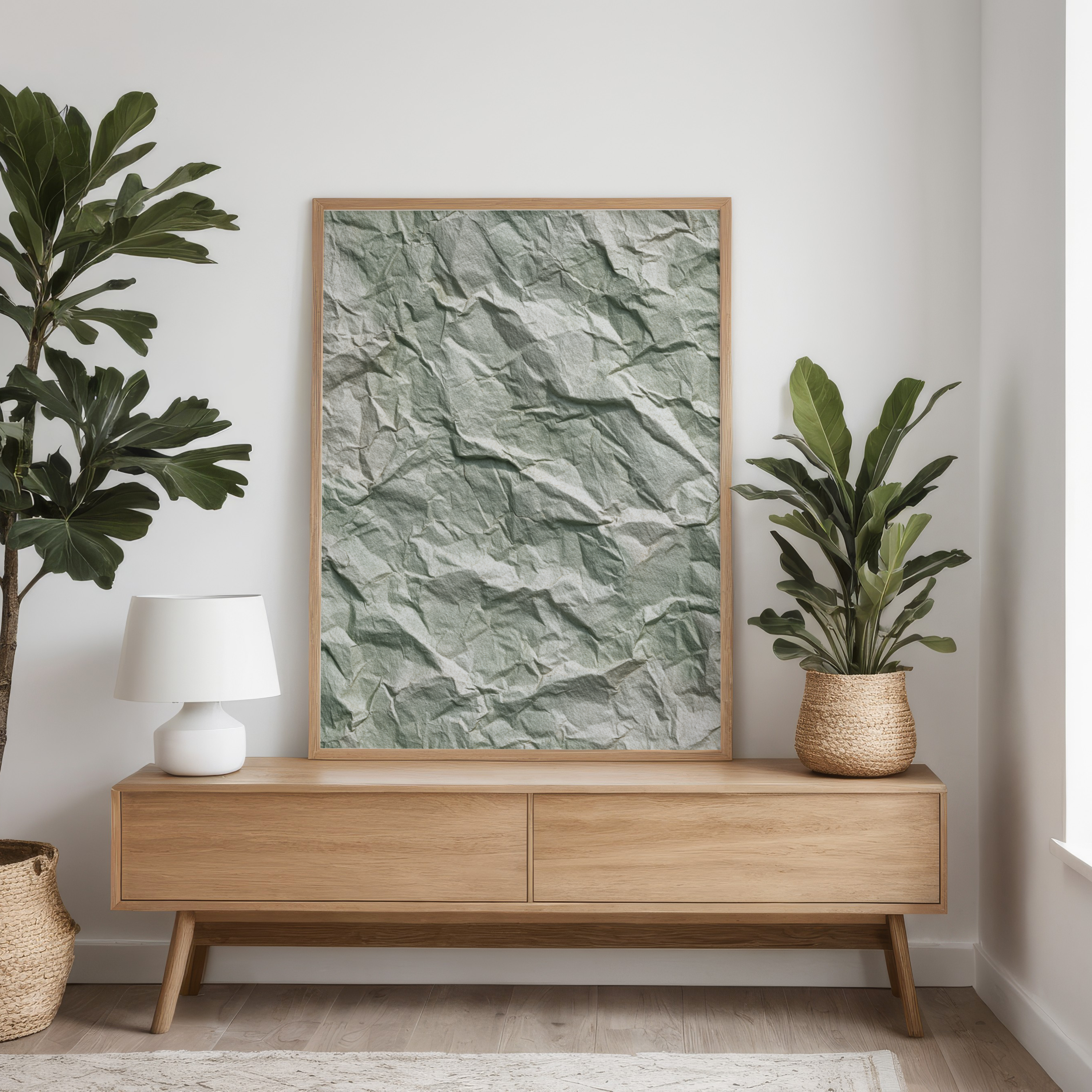 Room interior with wooden sideboard, framed artwork, and plants.