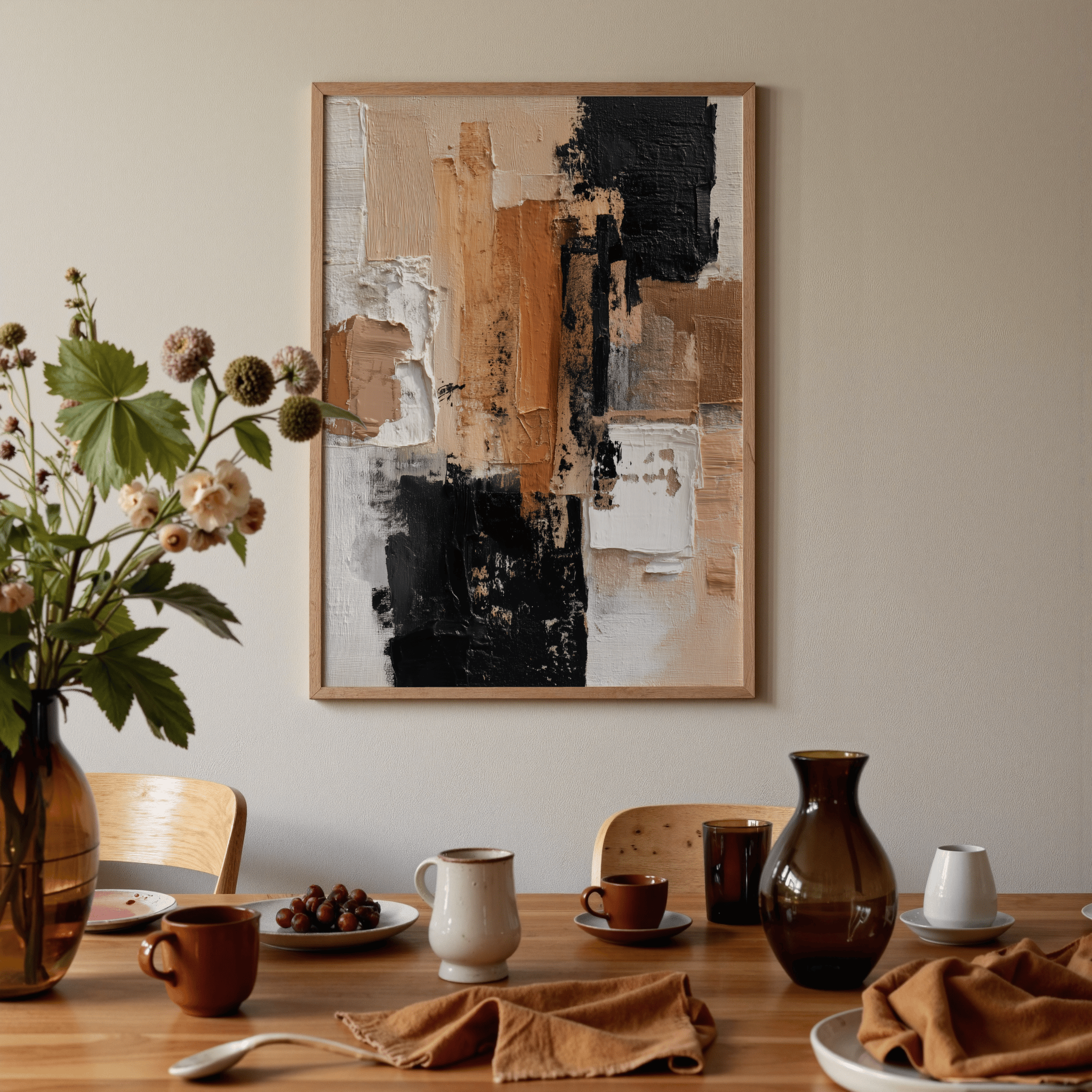Dining room with abstract art on the wall, table set with plates, cups, and a vase.