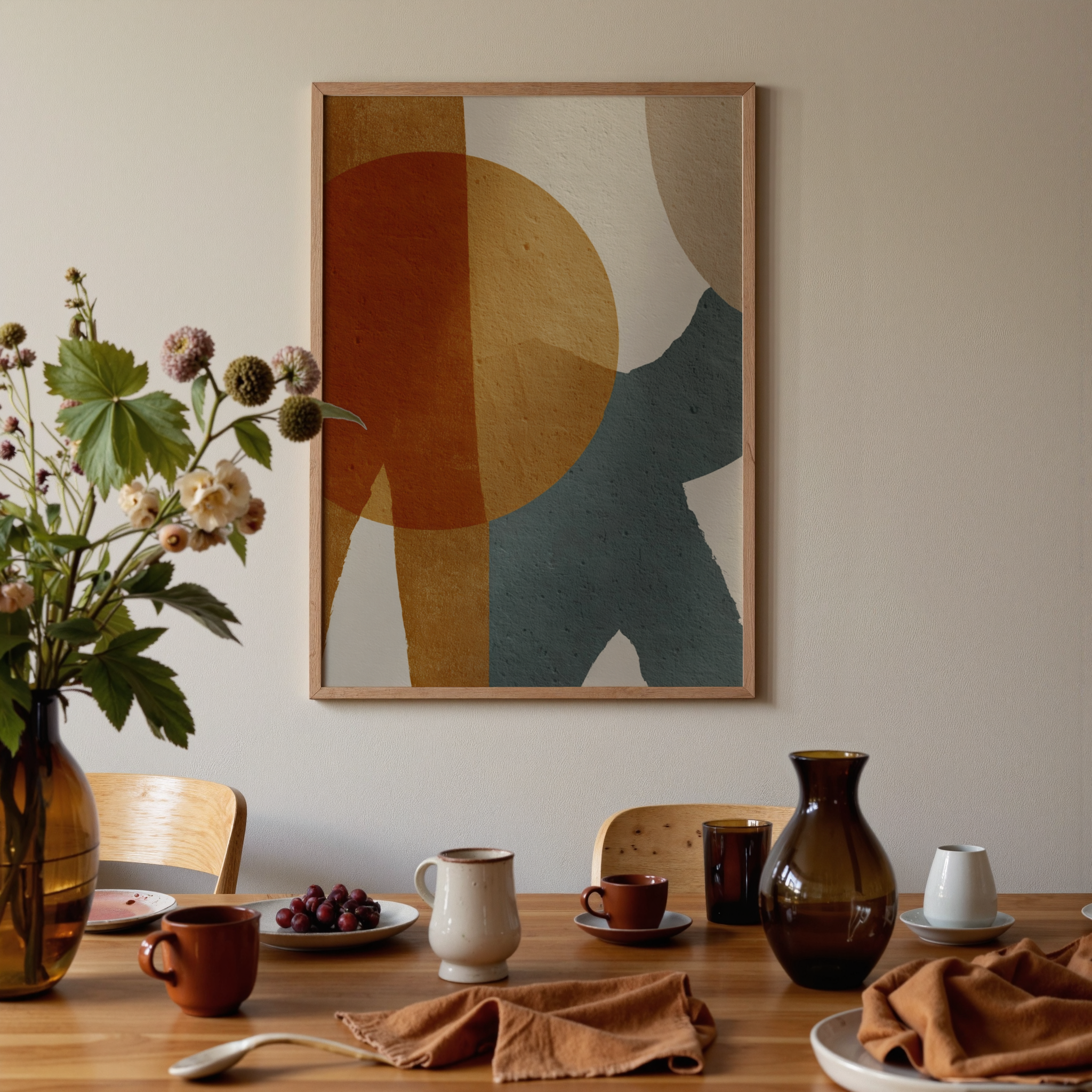 Dining room with abstract art on the wall, table setting, and decorative elements.