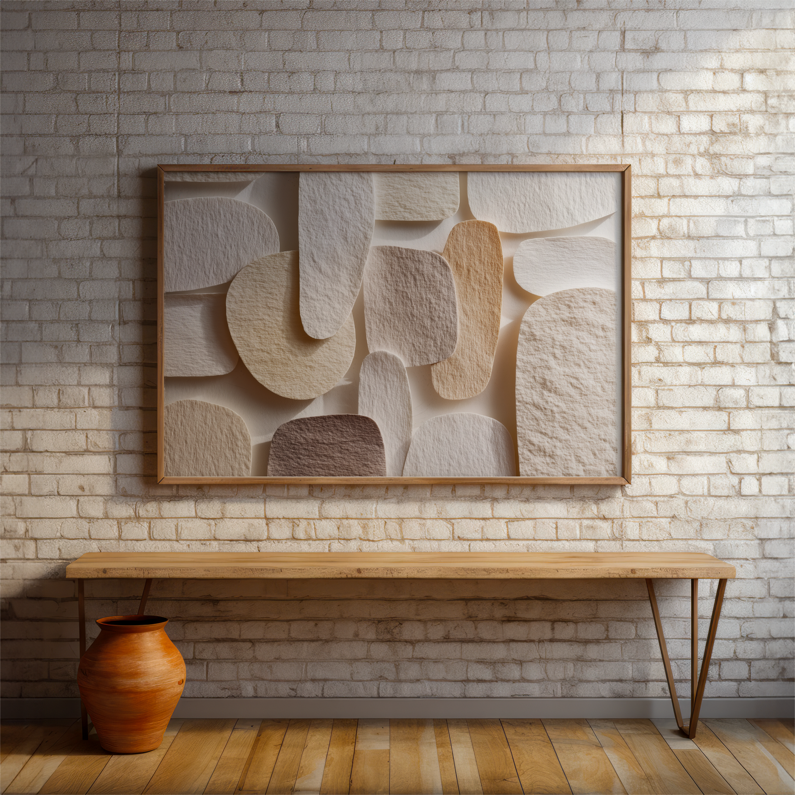 Abstract wall art piece on a brick wall with a wooden bench and vase in the foreground.