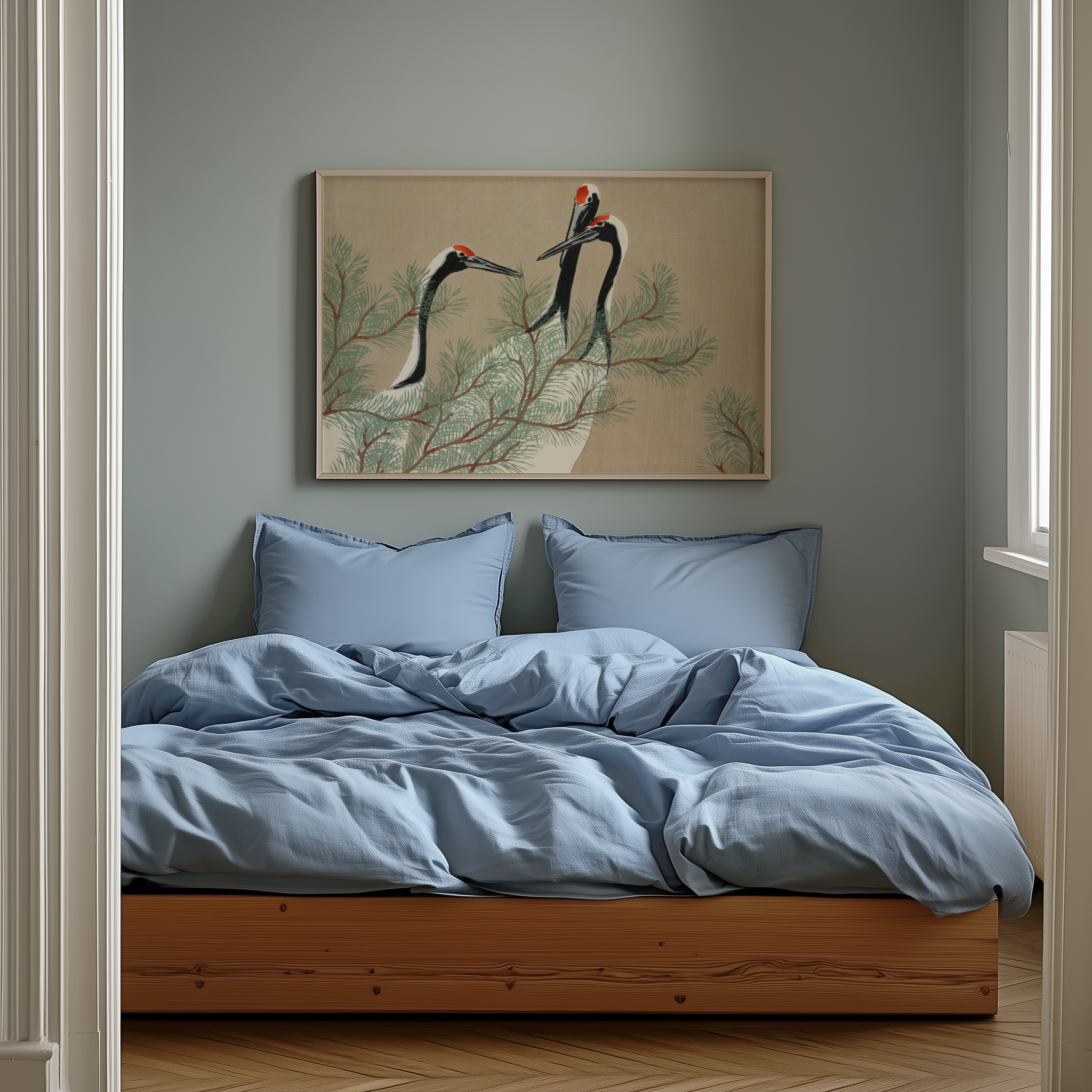 Bedroom with light blue bedding and a framed artwork on the wall.