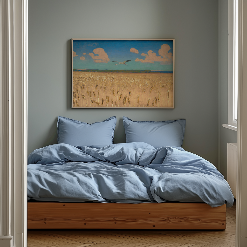 Bedroom with blue bedding and a framed landscape painting on the wall.