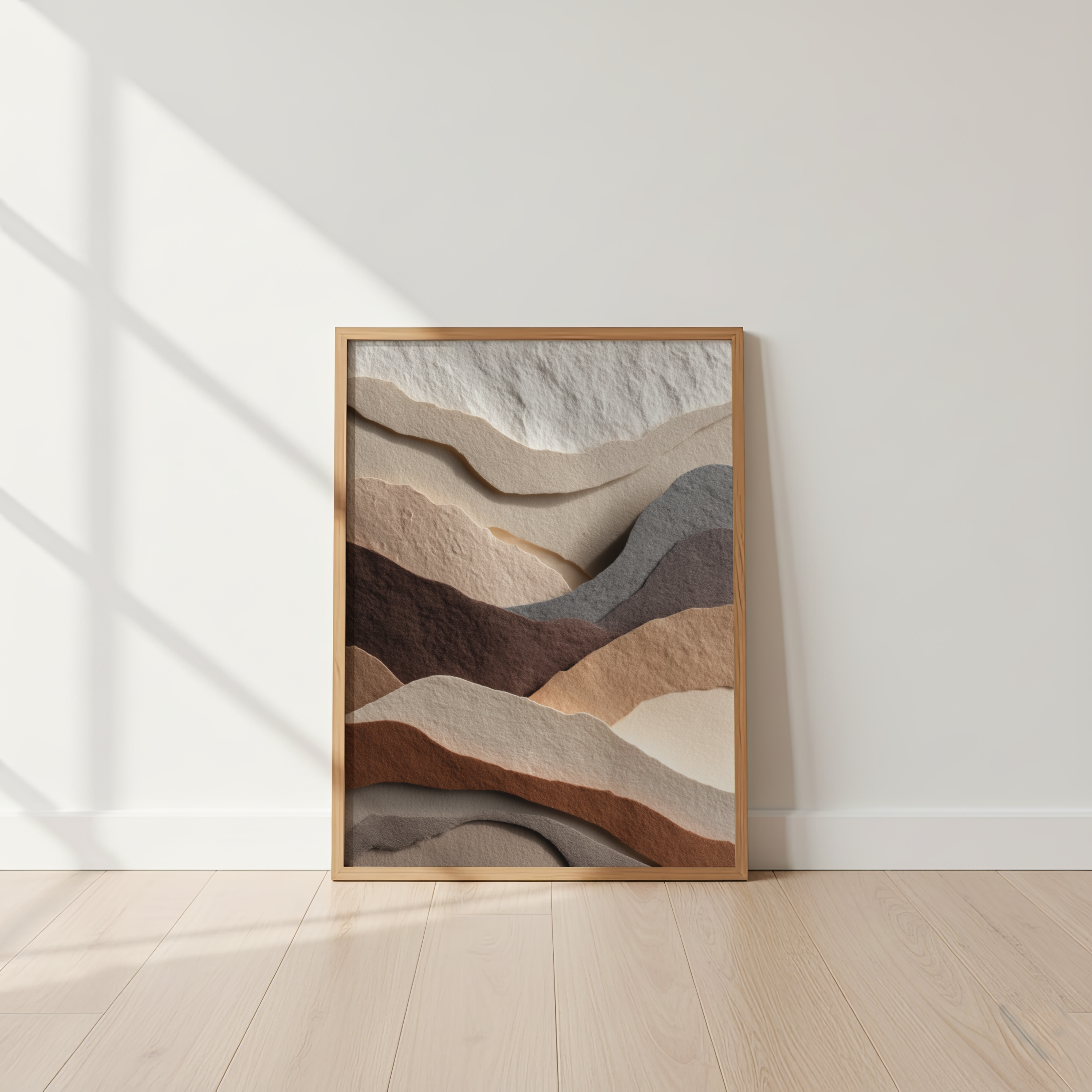 Framed abstract art with wavy patterns in earth tones on a white wall.