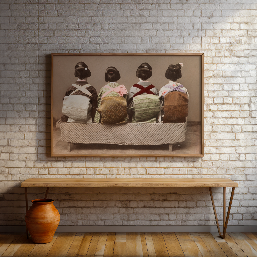 Framed artwork of four women in traditional attire on a brick wall with a wooden bench below.