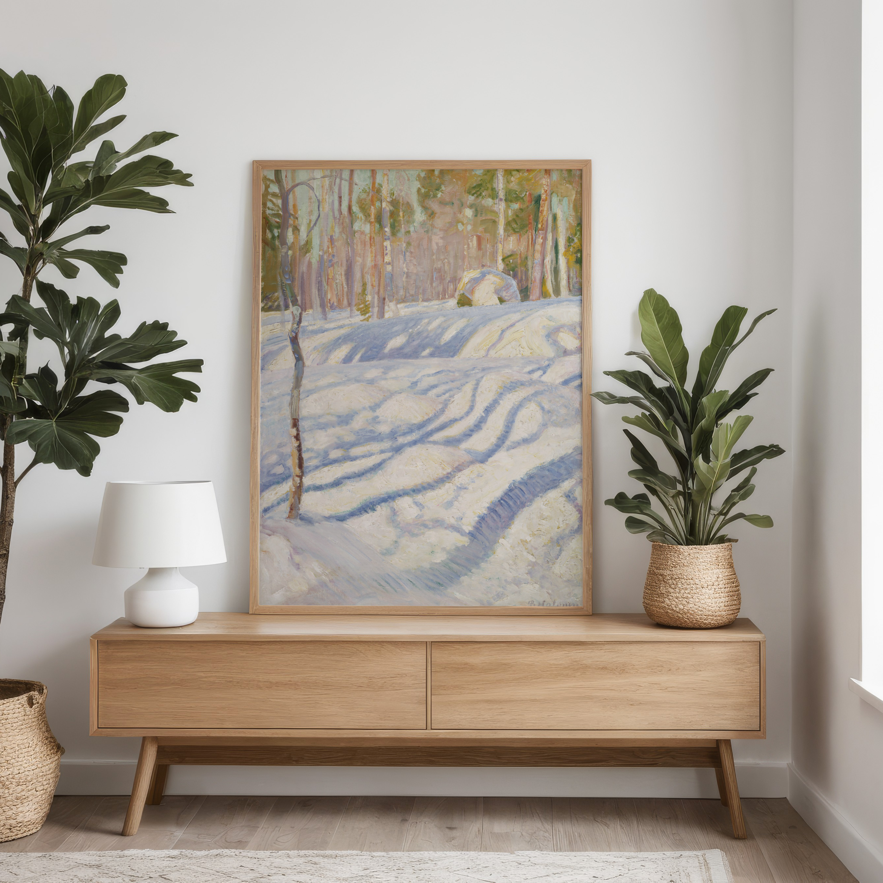 Wooden console table with a painting and plants in a room setting