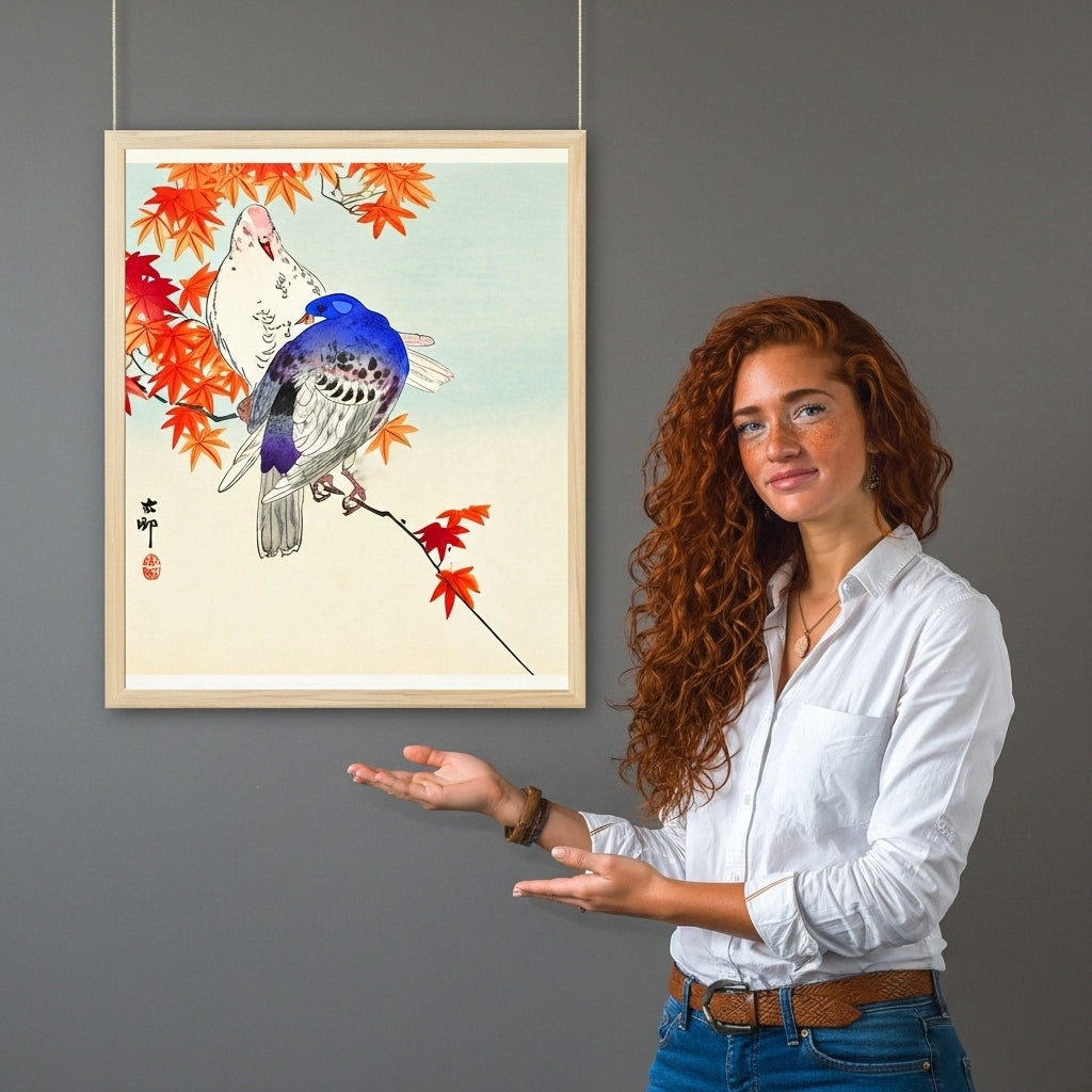 Woman standing next to a framed artwork of birds and autumn leaves on a gray wall.